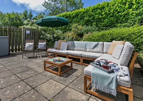 The patio & outdoor sitting area at Buckland Barn, Buckland Brewer