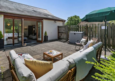 The patio & outdoor sitting area at Buckland Barn, Buckland Brewer