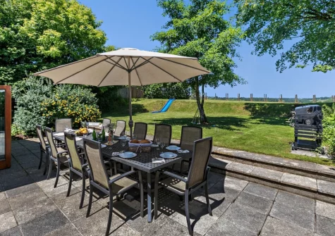 The patio, barnecue, alfresco dining area & large enclosed lawned garden at Buckland Barn, Buckland Brewer