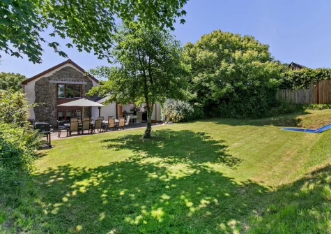 The large enclosed lawned garden at Buckland Barn, Buckland Brewer