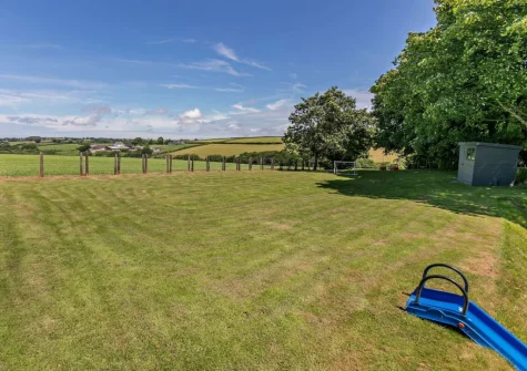 The large enclosed lawned garden at Buckland Barn, Buckland Brewer
