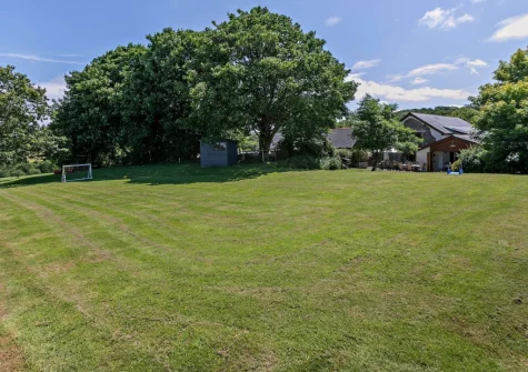 The large enclosed lawned garden at Buckland Barn, Buckland Brewer