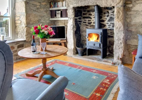 Bumbles, Mousehole is a characterful three-bedroom granite cottage with sweeping sea views over Mount's Bay, a private summerhouse, terraced garden, and easy access to this charming Cornish fishing village's harbour, shops and galleries.
