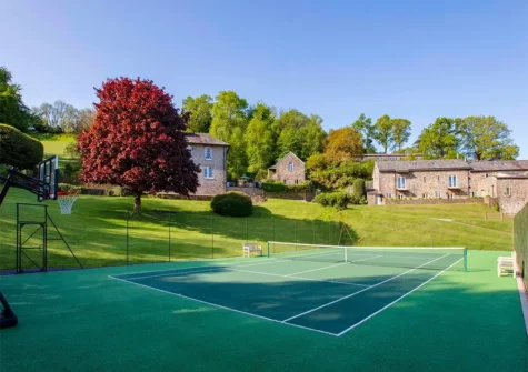The communal tennis court at Gitcombe Estate, Cornworthy
