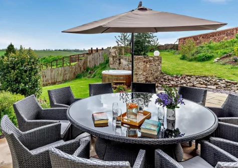 The patio & alfresco dining area at Burrow Farmhouse, Staple Cross