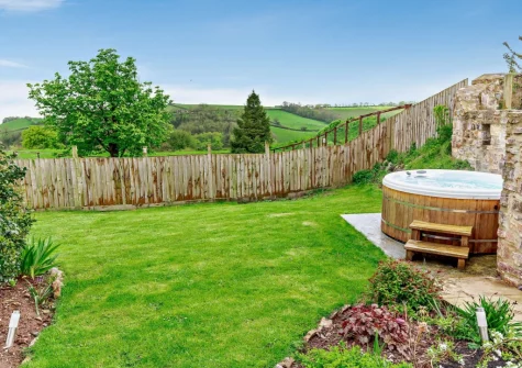 The garden & hot tub at Burrow Farmhouse, Staple Cross