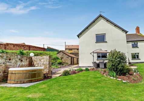 The patio, garden & hot tub at Burrow Farmhouse, Staple Cross