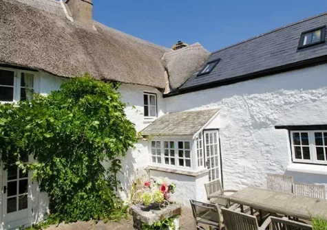 The patio & alfresco dining area at Burrows Farmhouse, Croyde