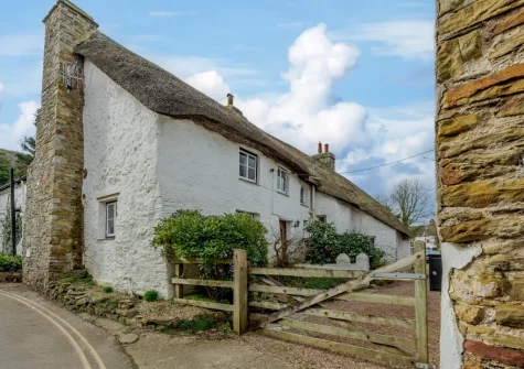 Burrows Farmhouse is a delightful Grade II listed thatched cottage full of original features, ideally located in the heart of Croyde