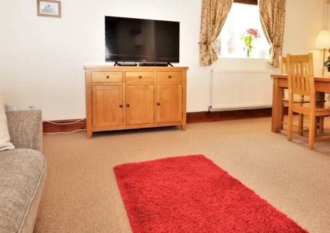 Burscombe Farm, Sidbury is a welcoming two-bedroom cottage on a working dairy farm in rural Devon, offering hands-on animal experiences for children, enclosed gardens with barbecue, and wonderful access to Sidmouth's beaches and Devon attractions.