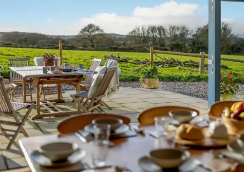 The patio & alfresco dining area at Butter Barn At Pengelly Farm, Nancegollan