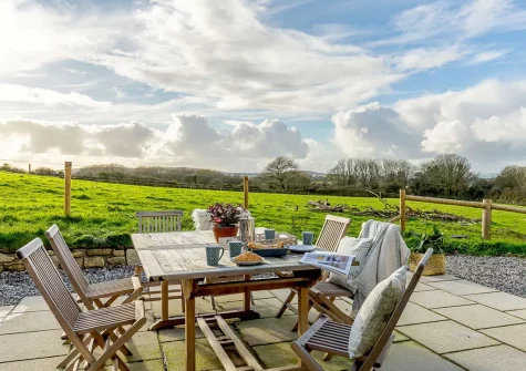 The patio & alfresco dining area at Butter Barn At Pengelly Farm, Nancegollan