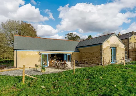 Butter Barn At Pengelly Farm is a stunning, detached, split level barn conversion positioned on a working farm