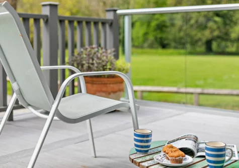 The decked terrace & outdoor sitting area at Buttercup at The Camel Trail, Tredethy