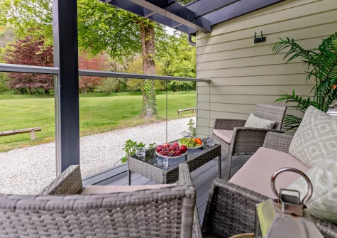 The decked terrace & outdoor sitting area at Buttercup at The Camel Trail, Tredethy