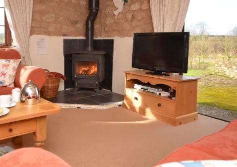 Buzzard Cottage, Sheldon is a spacious six-bedroom retreat in the Blackdown Hills AONB, featuring a private hot tub, games room, seven-acre dog exercise field, and easy access to Devon's stunning Jurassic Coast and countryside attractions.