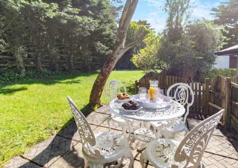 The terrace, babrecue, alfresco dining area & lawned garden at Buzzards Cottage, Redruth