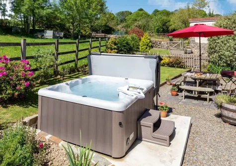 The hot tub  & alfresco dining area at Buzzards Reach, Lower Treslea Farm, Treslea