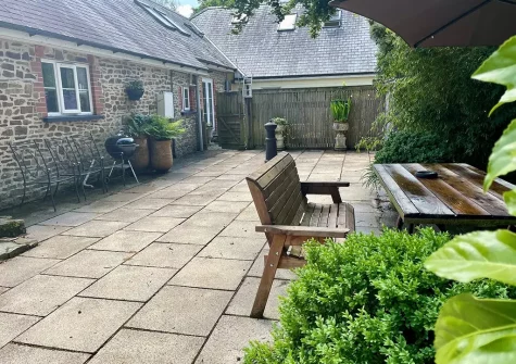 The patio, barbecue & alfresco dining area at Byre Cottage, Bagbeare, Thornbury