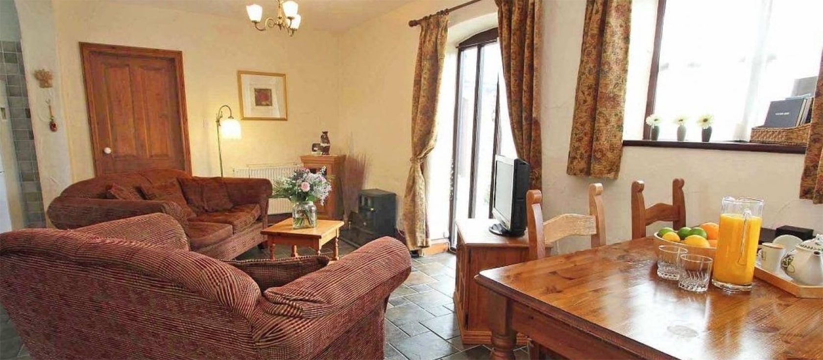 Byre Cottage, Portreath is a well-equipped barn conversion on a farm with two bedrooms & two bathrooms. Open-plan living includes an electric woodburner, comfy sofas & well-equipped kitchen. Dine on the patio with rural views while kids play on the lawn.