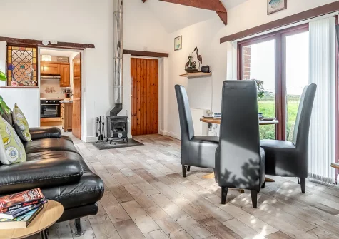 Byre Cottage, Padstow is a characterful two-bedroom stone barn conversion set in peaceful countryside just over a mile from historic Padstow. Enjoy stunning panoramic views, cosy wood burner evenings, and delightful garden spaces.