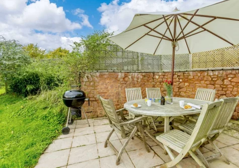 The patio, barbecue & alfresco dining area at Cabana Lakeside Lodge 2, Whitnage