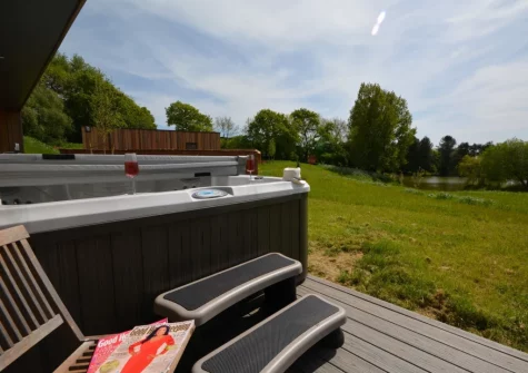 The decked terrace & hot tub at Cabana Lakeside Lodge 4, Whitnage