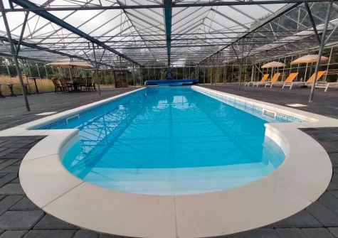 The shared indoor heated swimming pool at Camellia Cottage In The Tamar Valley, Bere Alston