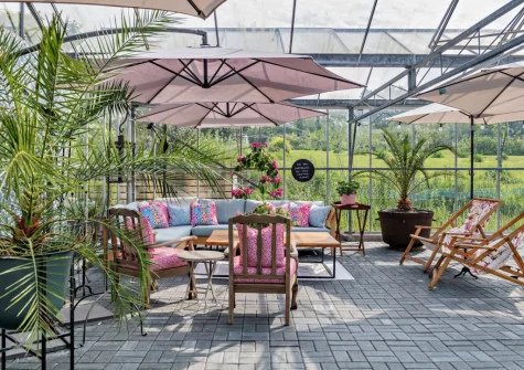 The shared poolside sitting area at Camellia Cottage In The Tamar Valley, Bere Alston