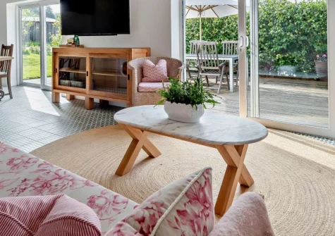 Camellia Cottage In The Tamar Valley, Bere Alston is a peaceful single-storey retreat beside the River Tamar, featuring a private heated indoor pool, south-facing terrace, and easy access to Dartmoor's dramatic landscapes and Plymouth's waterfront.