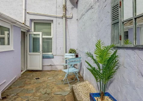 The courtyard & outdoor sitting area at Captains Cottage, Brixham