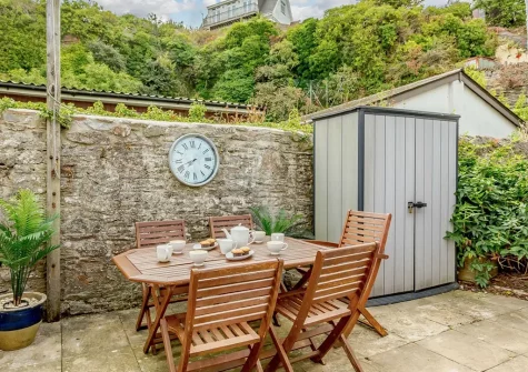 The patio & alfresco dining area at Captains Cottage, Brixham