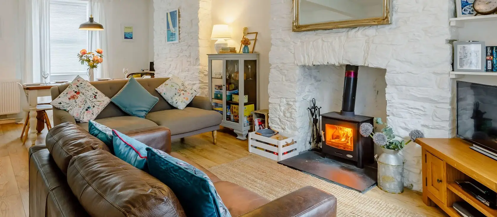 Captains Cottage, Brixham is a charming three-storey coastal retreat with cosy wood burner, enclosed garden, and proximity to the historic harbour. Perfect for families seeking maritime adventures and English Riviera exploration with modern comfort.