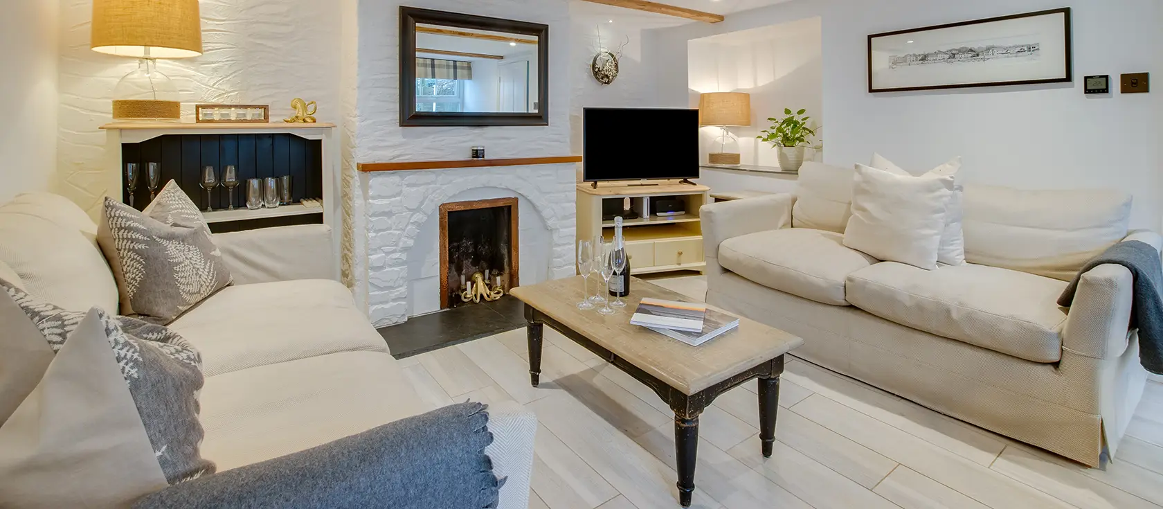 Captains Cottage, Padstow is a charming 3-bedroom retreat situated in a peaceful private courtyard near the harbour. With exposed beams, slate hearth fireplace, and lovely outdoor space, it's perfect for exploring Cornwall's coast and attractions.