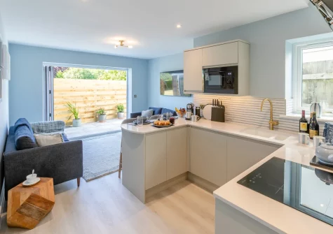 The living area & kitchen at Carlyon Bay Lodge, Carlyon Bay