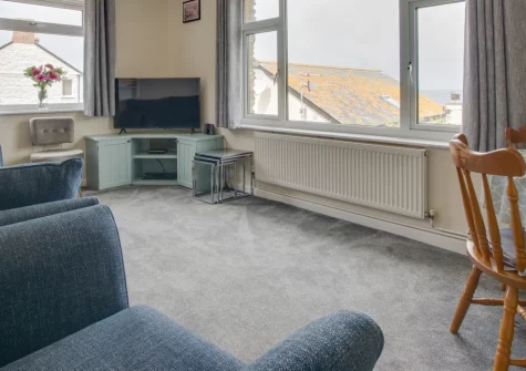 Carn Base, Sennen Cove is a secluded three-bedroom bungalow just metres from Whitesand Bay, featuring a sunny garden with sweeping coastal views, private parking, and easy access to Cornwall's finest surf beaches and coastal path walks.