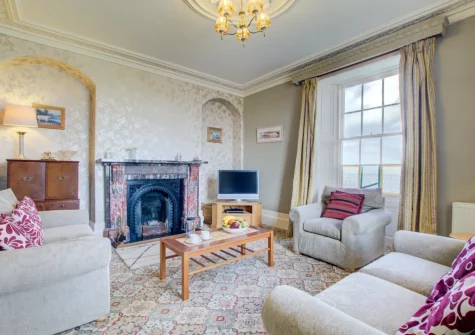 The living room at Carnevas Farmhouse, Porthcothan