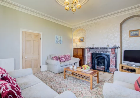 The living room at Carnevas Farmhouse, Porthcothan