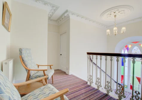 The sitting area on the first floor landing at Carnevas Farmhouse, Porthcothan