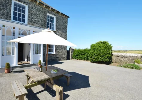 The patio & alfresco dining area at Carnevas Farmhouse, Porthcothan