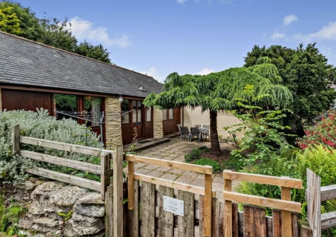 The enclosed patio garden & alfresco dining area at Cart Linhay Cottage, Bittadon