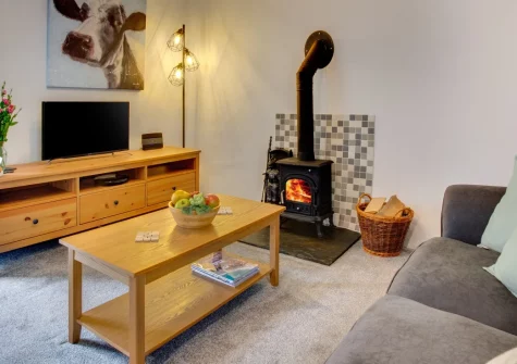 Carthew Mill Cottage, Newbridge is a romantic two-storey retreat near Penzance, featuring a cosy wood burner, a tranquil conservatory, an enclosed garden and a warm welcome for up to three dogs amid Cornwall's wild moorland scenery and coastal charm.