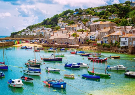 Mousehole is considered one of Cornwall's prettiest fishing villages, with two small sandy beaches inside its harbour quays, only accessible at low tide