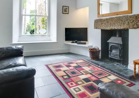 Carvosso, Mousehole is a beautifully renovated two-bedroom cottage just moments from the picturesque fishing village, featuring contemporary interiors with wood burner, an enclosed courtyard garden, and access to West Cornwall's stunning coastline.