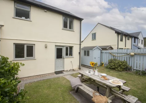 The patio, alfresco dining area & rear south-west facing garden at Castaways, Porthtowan