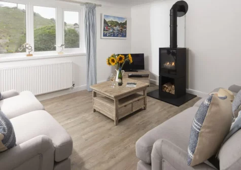 Castaways, Porthtowan is a charming three-bedroom holiday home moments from the Blue Flag sandy beach, offering wonderful sea views, a cosy sitting room with gas fire, an enclosed garden, and easy access to the South West Coast Path in Cornwall.