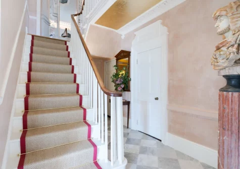 The hallway & stairs up to the first floor at Castle Lodge, Truro