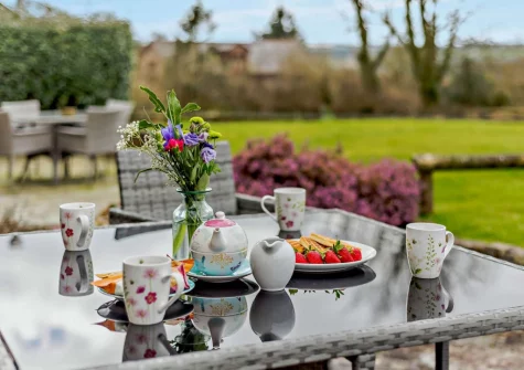 The patio & alfresco dining area at Cedar Cottage, Woolsery