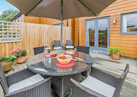 The decked patio, barbecue & alfresco dining area at Cedar, Goldenbank