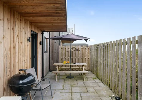 The patio, alfresco dining & barbecue area at Cedar House, Presingoll Barns, St Agnes
